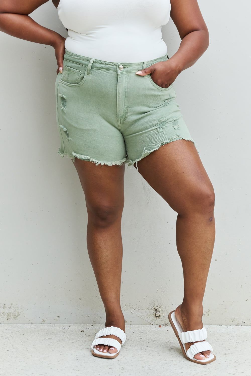 RISEN Katie High Waisted Distressed Shorts in Gum Leaf