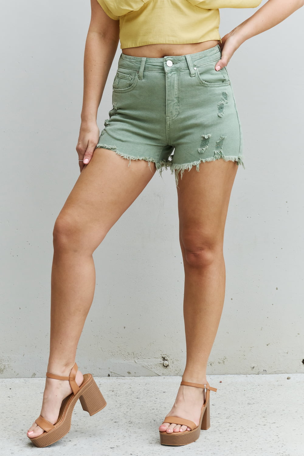 RISEN Katie High Waisted Distressed Shorts in Gum Leaf